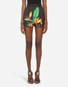 DOLCE & GABBANA SHORTS IN DRILL WITH BIRD OF PARADISE PRINT