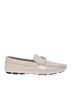 PRADA LEATHER LOAFERS IN TALC COLOR