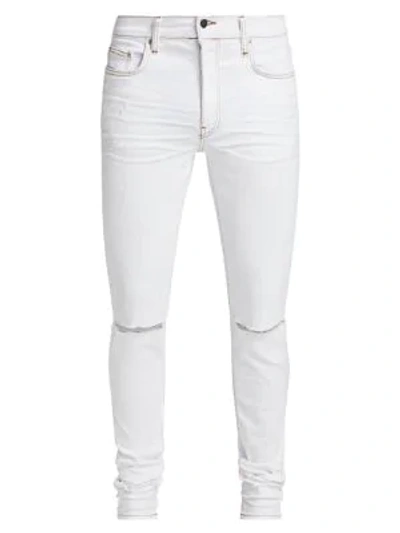 Amiri Slash Skinny-fit Distressed Stretch-denim Jeans In White