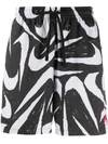 NIKE CITY EDITION LOGO-PRINT SWIM SHORTS