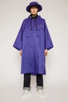 ACNE STUDIOS Reflective face motif poncho Sea Blue