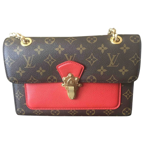 Pre-Owned Louis Vuitton Victoire Brown Cloth Handbag | ModeSens