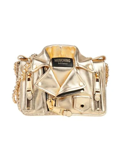 Moschino Handbags In Gold
