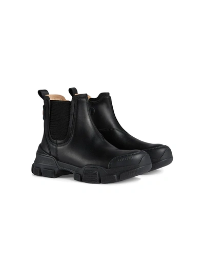 GUCCI LOGO PATCH ANKLE BOOTS