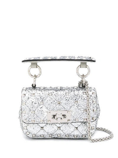 Valentino Garavani Rockstud Spike Micro Glitter Crossbody Bag In Silver