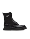 Prada Logo-plaque Panelled Ankle Boots In Black