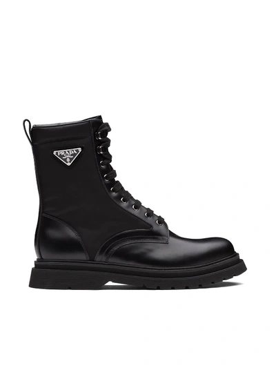 Prada Logo-plaque Panelled Ankle Boots In Black
