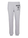 MOSCHINO LOGO PRINT COTTON TRACK PANTS IN GREY