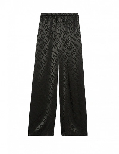 Balenciaga Allover Large Logo Trousers In Black