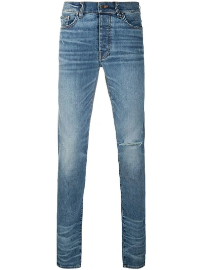 AMIRI RIPPED MID-RISE SKINNY JEANS