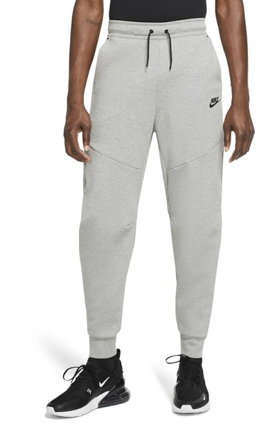 Nike Sportswear Tapered Logo-print Cotton-blend Tech-fleece Sweatpants In Grey