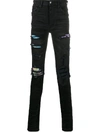 AMIRI distressed skinny jeans