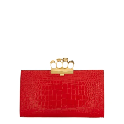 Alexander Mcqueen Skull Four Ring Crocodile-effect Leather Clutch In Red