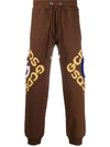 Gcds Graphic Logo Track Pants In Brown