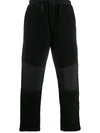 MAHARISHI BUCKLE-FASTENING PANELLED TROUSERS