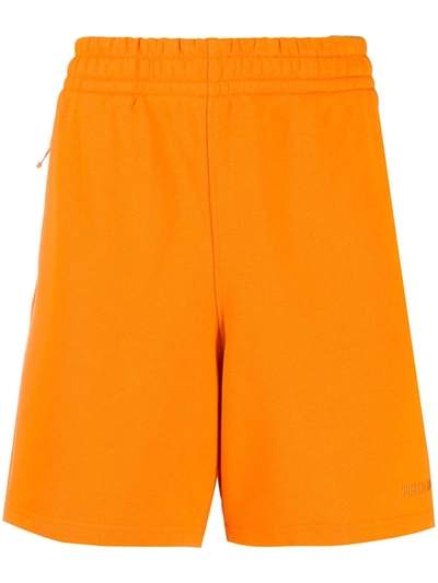 Adidas Originals By Pharrell Williams 平纹针织运动短裤 In Orange
