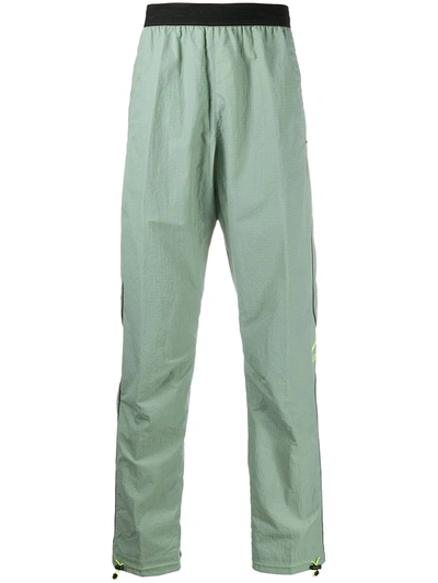 Nike Dna Piped Track Pants In Green