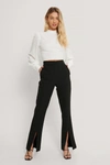 ANDREA BADENDYCK X NA-KD FRONT SLIT SUIT PANTS - BLACK