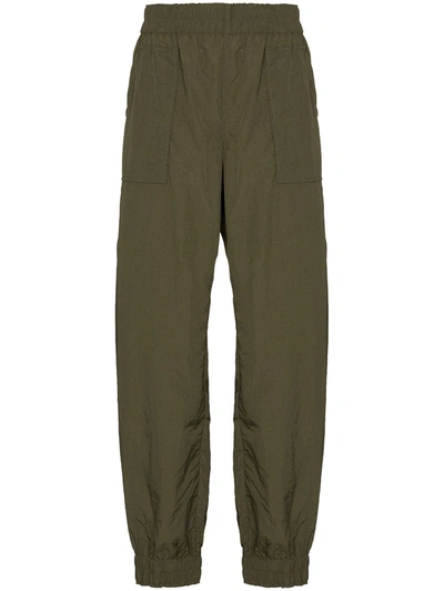 Ganni Crinkled-effect Tapered Track Trousers In Green