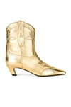 Khaite Dallas Laminated Leather Boots In Gold