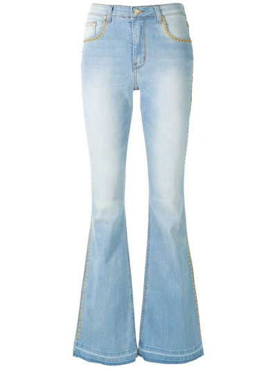 Amapô Flared Denim Trousers With Studs In Blue