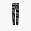WE11 DONE MONOGRAM KNIT FITTED TROUSERS