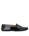 Tod's Gommino Moccasins In Patent-effect Leather In Dark Brown