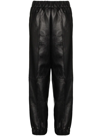 Ganni Leather Tapered-fit Trousers In Black