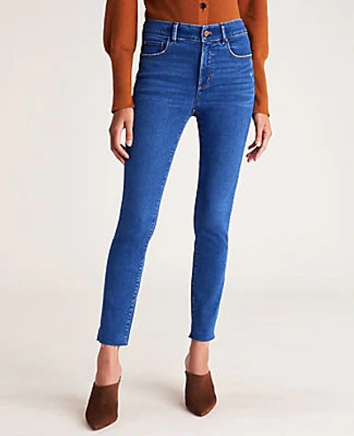 Ann Taylor Petite Curvy Sculpting Pocket Mid Rise Skinny Jeans In Mid Stone Wash