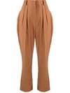 Nanushka Cropped Pleated Cotton-blend Tapered Pants In Brown