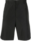 Prada Triangle Patch Logo Shorts In Schwarz