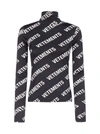 VETEMENTS ALL-OVER-LOGO TURTLENECK TOP,11686241