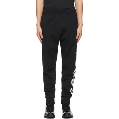 Etudes Studio Etudes Logo Printed Tapered Leg Pants In Black