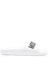 Moschino Embossed Logo Pool Slides In White