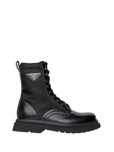 Prada Logo-plaque Panelled Ankle Boots In Black