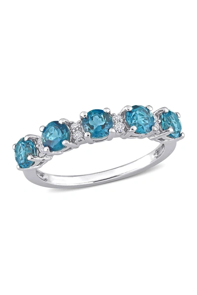 Delmar Sterling Silver Topaz Eternity Ring In Blue