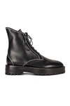 Alaïa Grommet Studded Lace-up Combat Boots In Noir