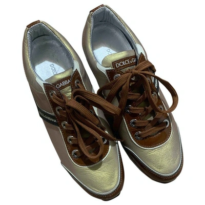 Pre-owned Dolce & Gabbana Patent Leather Trainers In Gold