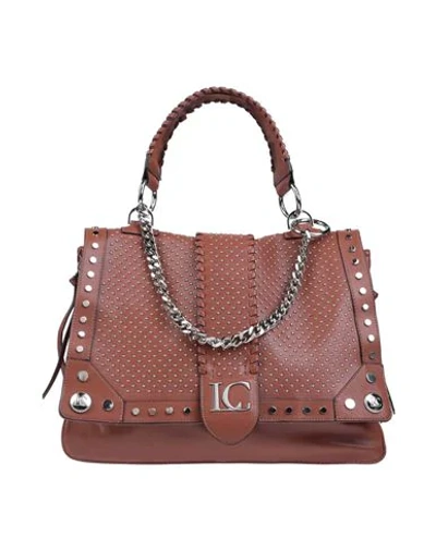 La Carrie Handbags In Brown