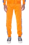 Kappa 222 Banda Rastoriazz Track Pants In Orange-blue Roya Aal