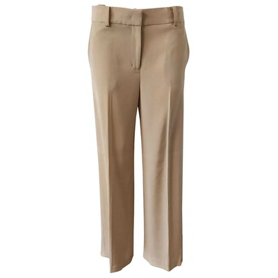 Pre-owned Dkny Trousers In Beige