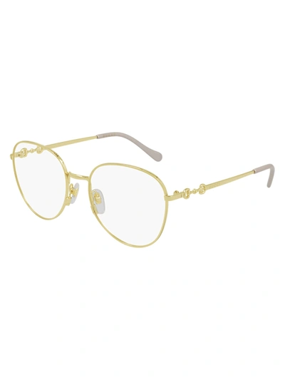 Gucci Gg0880o Eyewear In Gold Gold Transparent