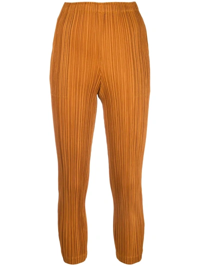 Issey Miyake Cropped Pleated Trousers In Orange