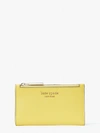 Kate Spade Spencer Small Slim Bifold Wallet In Yellow Sesame