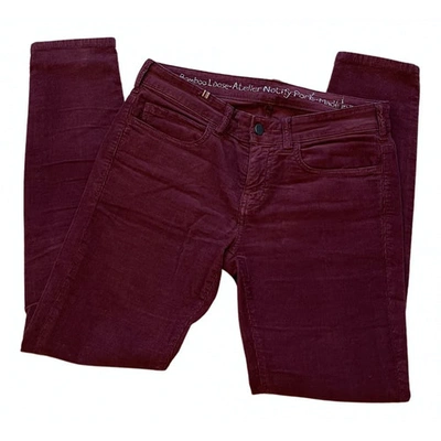 Pre-owned Notify Trousers In Burgundy