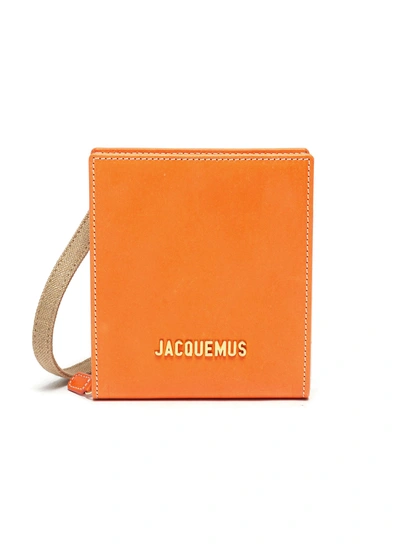 Jacquemus 'le Gadjo' Logo Embellished Leather Pouch In Orange