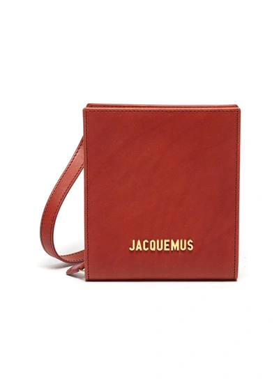 Jacquemus Le Gadjo' Logo Embellished Leather Pouch In Brown