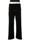 BALMAIN FLARED BLACK AND WHITE TROUSERS WITH BUTTONED LEGS