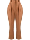 Nanushka Cropped Pleated Cotton-blend Tapered Pants In Brown