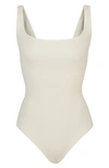 Skims Ribbed Stretch Cotton Bodysuit In Bone
